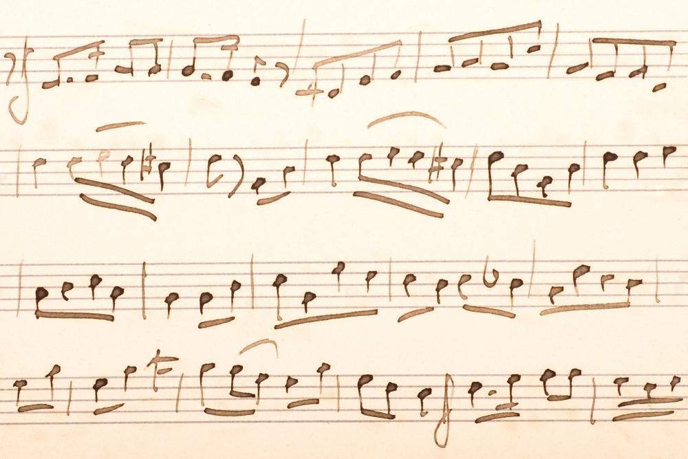Handwritten manuscript music on aged paper